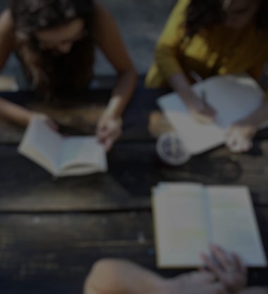 Three people studying at a table